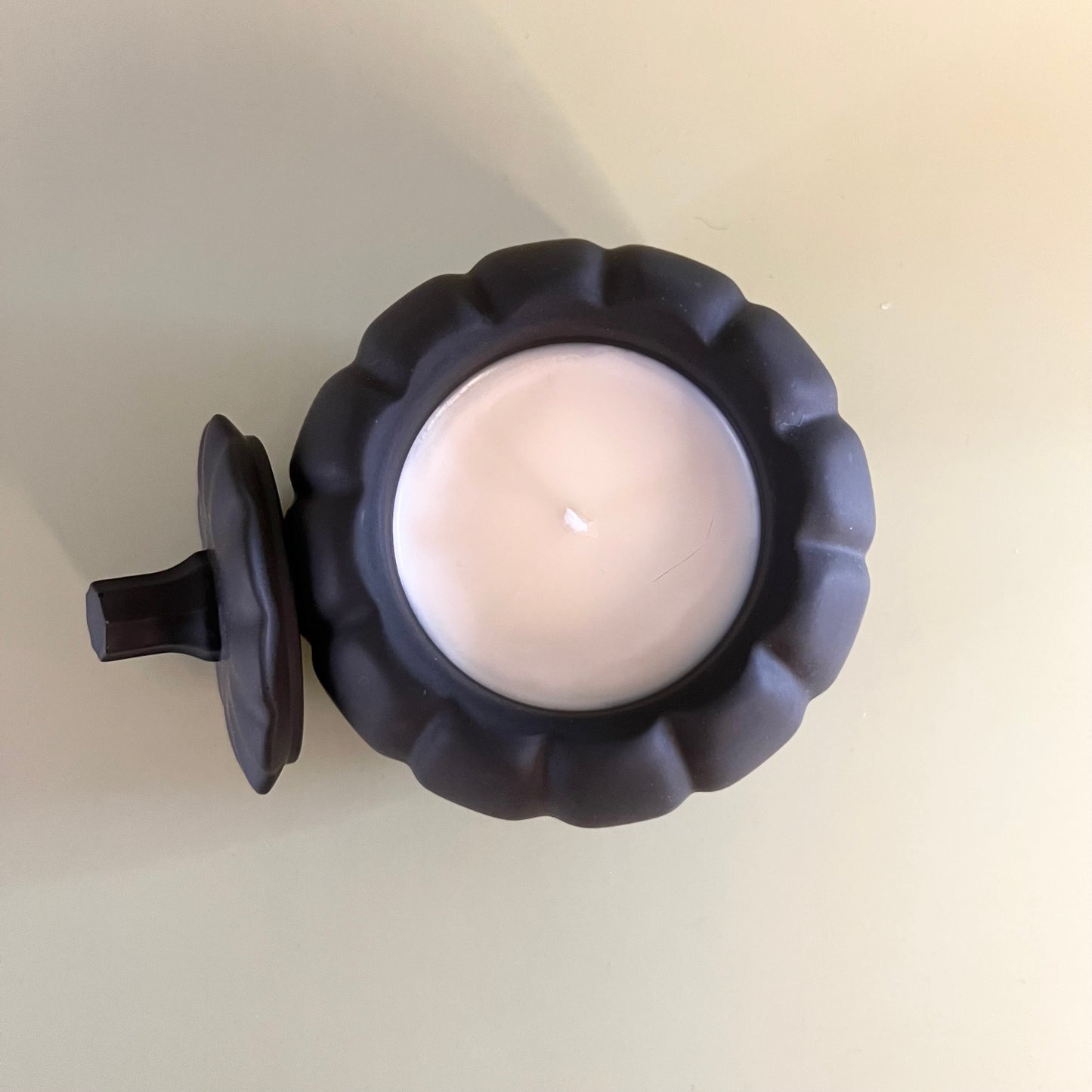 Pumpkin Candle in Black Container