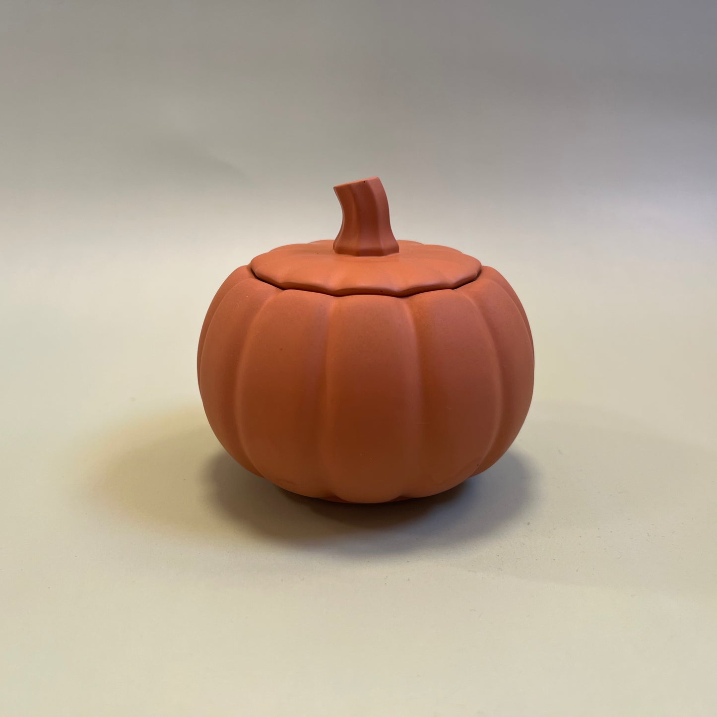 Pumpkin Candle in Orange Container